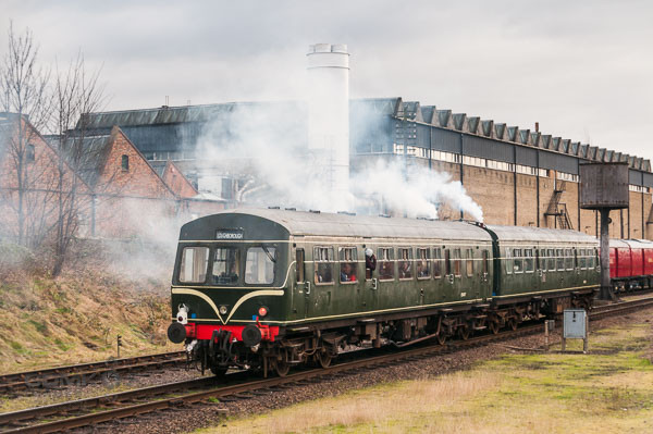 1960s style diesel multiple unit leaving Loughborough Station on the Great Central Railway