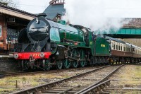 Southern Region N15 4-6-0 steam loco 777 Sir Lamiel heading a passenger train into Quorn railway station on the Great Central Railway