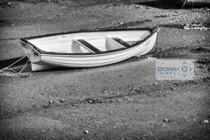 Black annd White photo of a dinghy at low tide on the River Teign near Shaldon