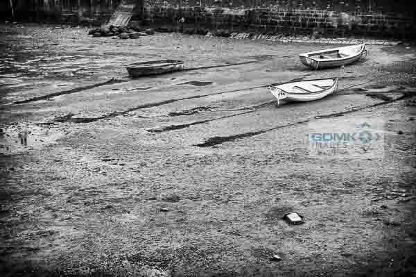 Black and White dinghies on the beach Black and White photo of 3 dinghies at low tide on the River Teign near Shaldon