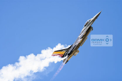 Royal Netherlands Airforce F-16 trailing white vapour during an airshow display