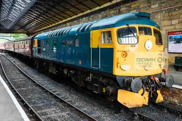 Class 26 diesel loco 26038 standing at the head of a passenger train at Pickering station on the North Yorks Moors Railway