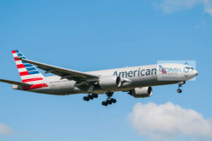 Side view of an American Airlines 777 aircraft on approach to land with landing gear down