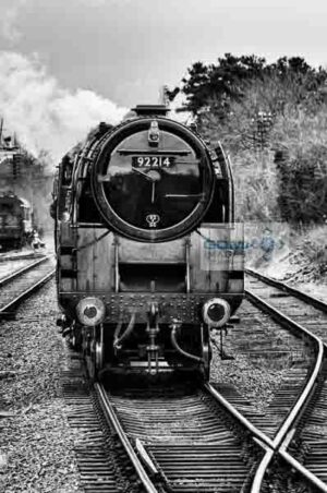 Front view of BR Standard 9F steam loco 92214 approaching Rothley station on the Great Central Railway