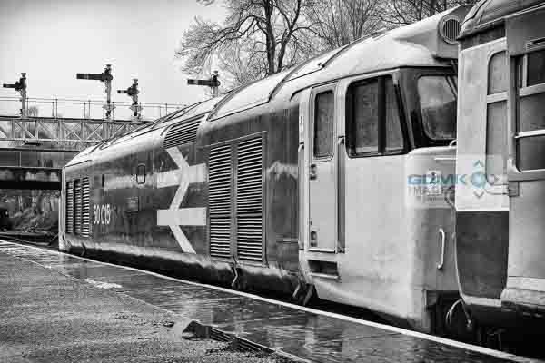 50015 Valiant standing in the rain at Bury Railway Station on the East Lancs Railway during the English Electric theme day on 11th January 2014. In the background is the impressive gantry of semaphore signals. The class 50 is heading a service to Heywood.