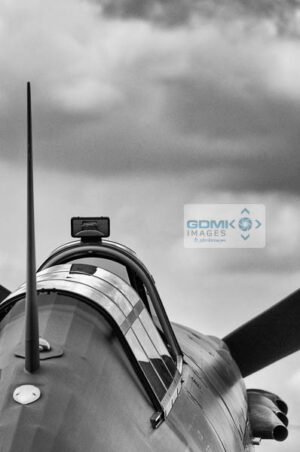 Black and white image of a Royal Air Force Hurricane under a stormysky