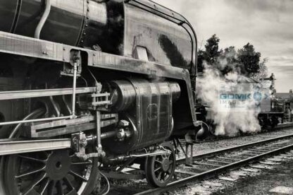 Black and white picture of Class 9F 92214 with Class 2MT 46521 steaming in the background