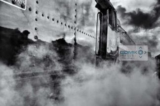 Atmospheric black and white picture of Class 9F steam loco engulfed in steam