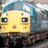 English Electric Class 37 at Bury Class 37 loco in BR Blue colour scheme working a passenger train on the East Lancs Railway
