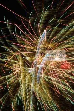 Gold, red and green fireworks explode at a firework display