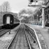 Steam train leaving Darley Dale Black and white image of a steam train leaving Darley Dale railway station on the Peak Rail preserved railway