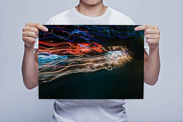 Man Holding Abstract Red and White Light Trails Wall Art Print