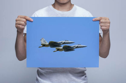 Man Holding Picture of an F-15 Pairs Takeoff Wall Art Print