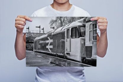Man Holding Black and White Class 50 Loco 50015 in the Rain Wall Art Print