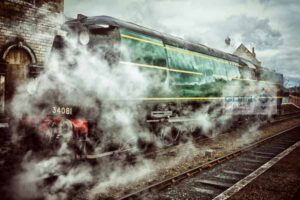 Bulleid Light Pacific 34081 92 Squadron engulfed in steam at Wansford railway station on the Nene Valley Railway