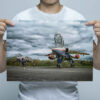 Man holding QinetiQ Jaguar and Harrier wall art print Man holding QinetiQ Jaguar and Harrier wall art print