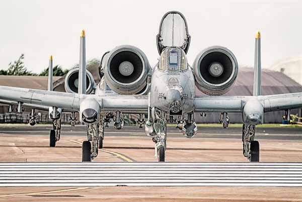 2 USAF A10 Tankbuster aircraft 2 A10 Tankbuster aircraft taxi across the runway at RAF Fairford