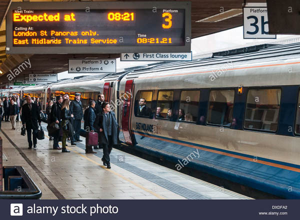 Passengers joining an East Midlands non stop express train to London at Leicester railway station