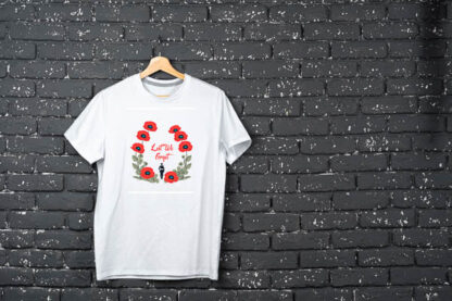 White t-shirt hanging on hanger against brick wall